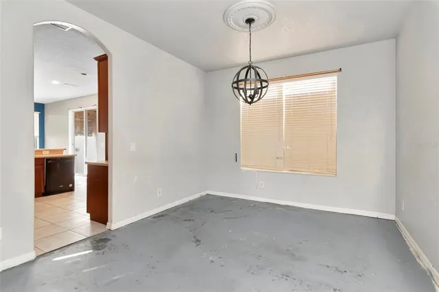 a view of a hallway with a chandelier