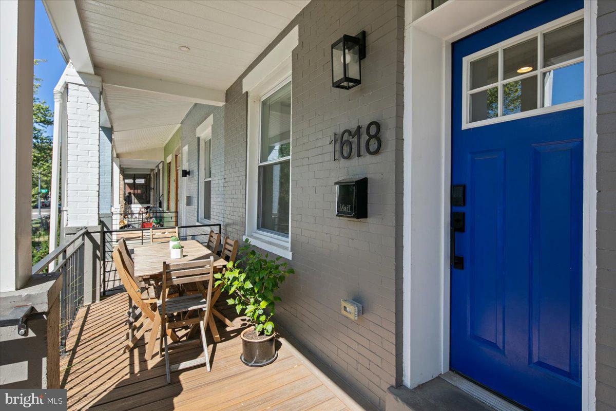 a view of a dining room with furniture and window