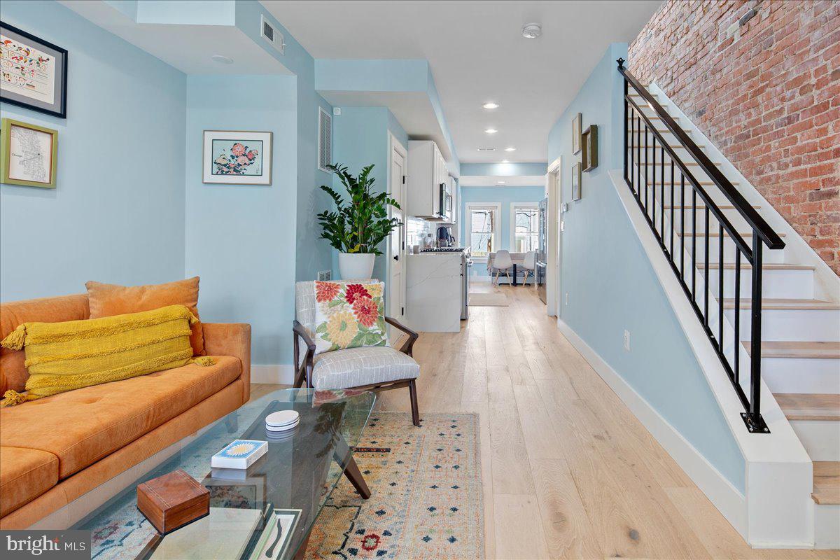 1618 G Street Southeast Washington, DC 20003 - Photo 11 of 53 a living room with furniture and a potted plant