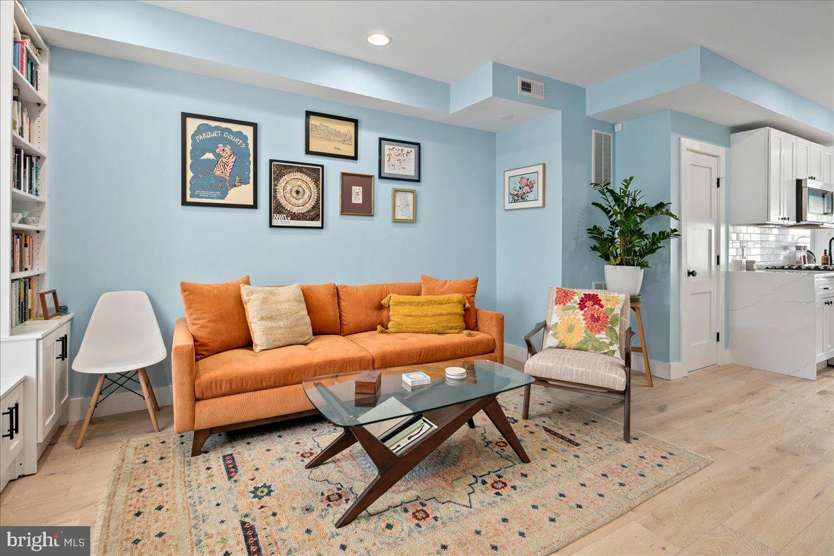 1618 G Street Southeast Washington, DC 20003 - Photo 13 of 53 a living room with furniture a rug and a window