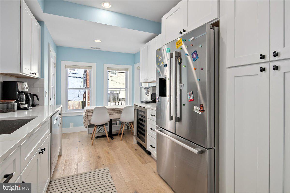 1618 G Street Southeast Washington, DC 20003 - Photo 17 of 53 a kitchen with stainless steel appliances granite countertop a refrigerator and a sink