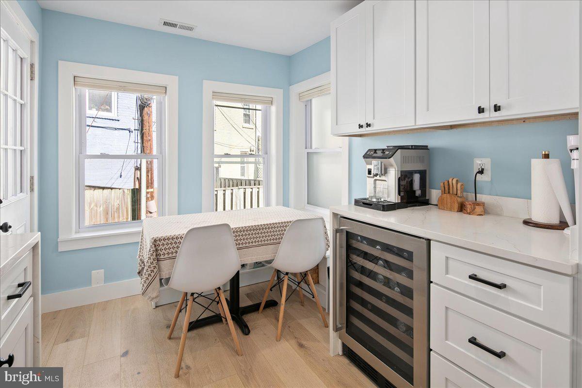 1618 G Street Southeast Washington, DC 20003 - Photo 19 of 53 a kitchen with sink cabinets and dining table chair