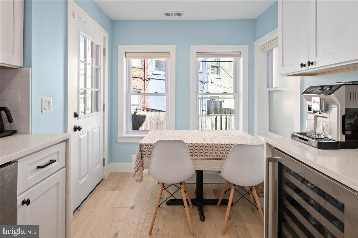 1618 G Street Southeast Washington, DC 20003 - Photo 20 of 53 a view of a dining room with furniture and a window