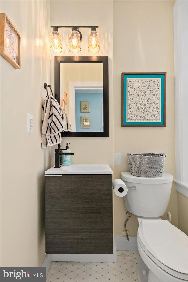 1618 G Street Southeast Washington, DC 20003 - Photo 23 of 53 a bathroom with a toilet a sink and mirror