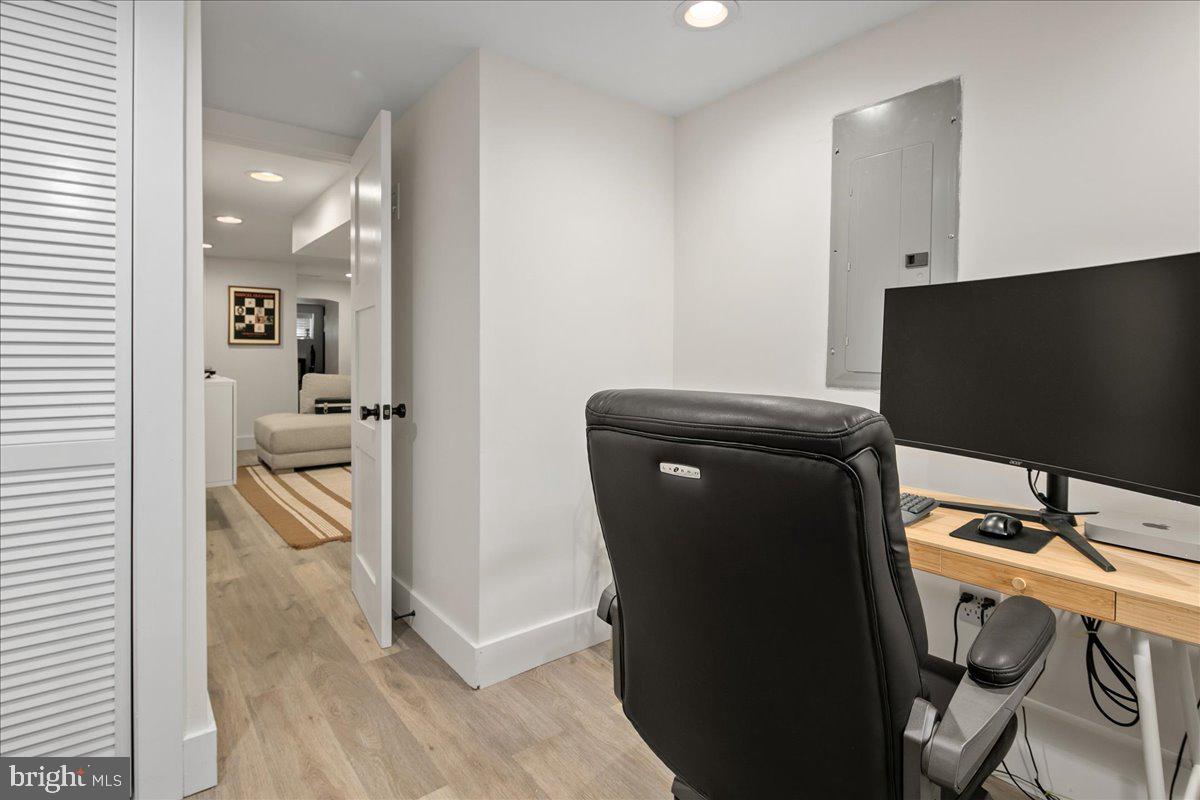 1618 G Street Southeast Washington, DC 20003 - Photo 26 of 53 a view of a workspace with furniture and wooden floor
