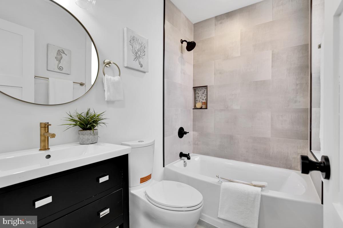 1618 G Street Southeast Washington, DC 20003 - Photo 33 of 53 a bathroom with a sink a toilet and a mirror