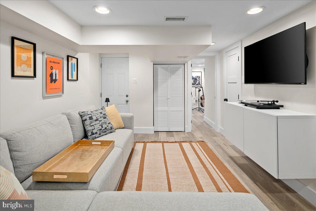 1618 G Street Southeast Washington, DC 20003 - Photo 48 of 53 a living room with a flat screen tv and a couch