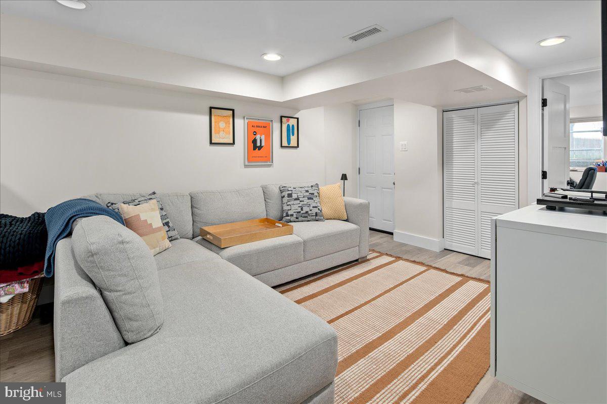 1618 G Street Southeast Washington, DC 20003 - Photo 5 of 53 a bedroom with a bed and a couch