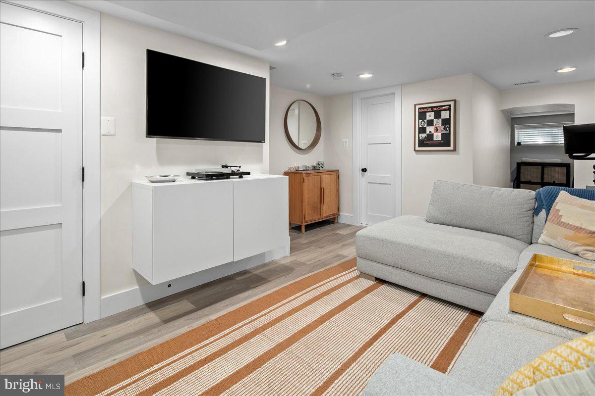 1618 G Street Southeast Washington, DC 20003 - Photo 51 of 53 a living room with furniture and a flat screen tv