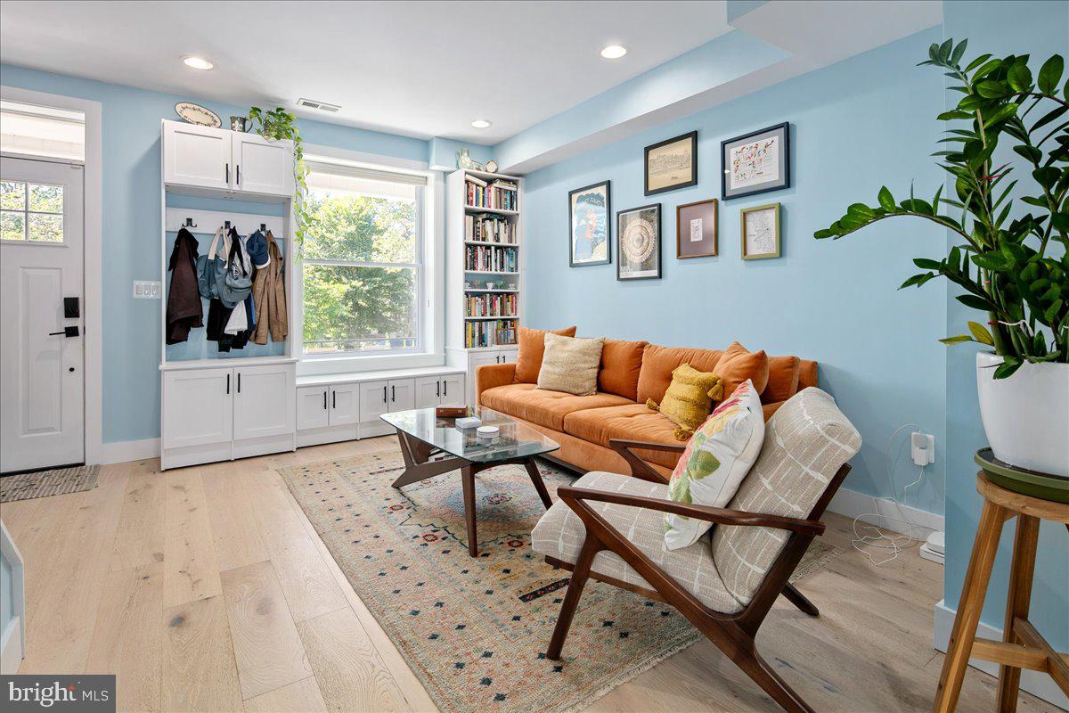 1618 G Street Southeast Washington, DC 20003 - Photo 8 of 53 a living room with furniture and a potted plant