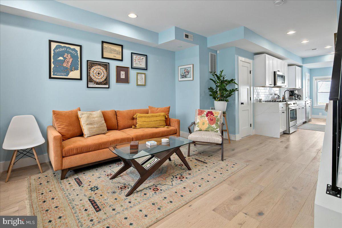 1618 G Street Southeast Washington, DC 20003 - Photo 10 of 53 a living room with furniture and kitchen view