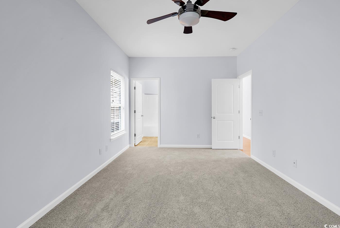 1636 Stuart Square Circle Myrtle Beach, SC 29577 - Photo 15 of 28 Unfurnished bedroom featuring light carpet and baseboards