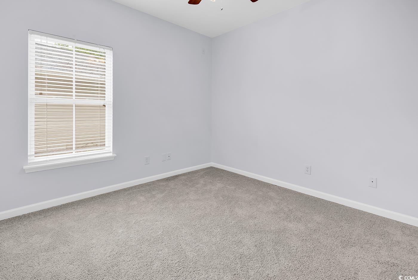 1636 Stuart Square Circle Myrtle Beach, SC 29577 - Photo 18 of 28 Unfurnished room with a ceiling fan and carpet floors