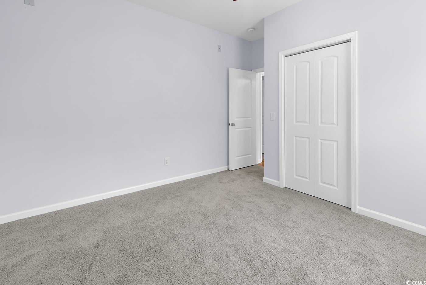 1636 Stuart Square Circle Myrtle Beach, SC 29577 - Photo 19 of 28 Unfurnished bedroom with carpet floors and a closet