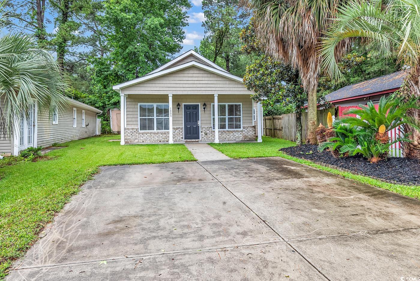 1636 Stuart Square Circle Myrtle Beach, SC 29577 - Photo 2 of 28 View of front of house with a porch and brick siding