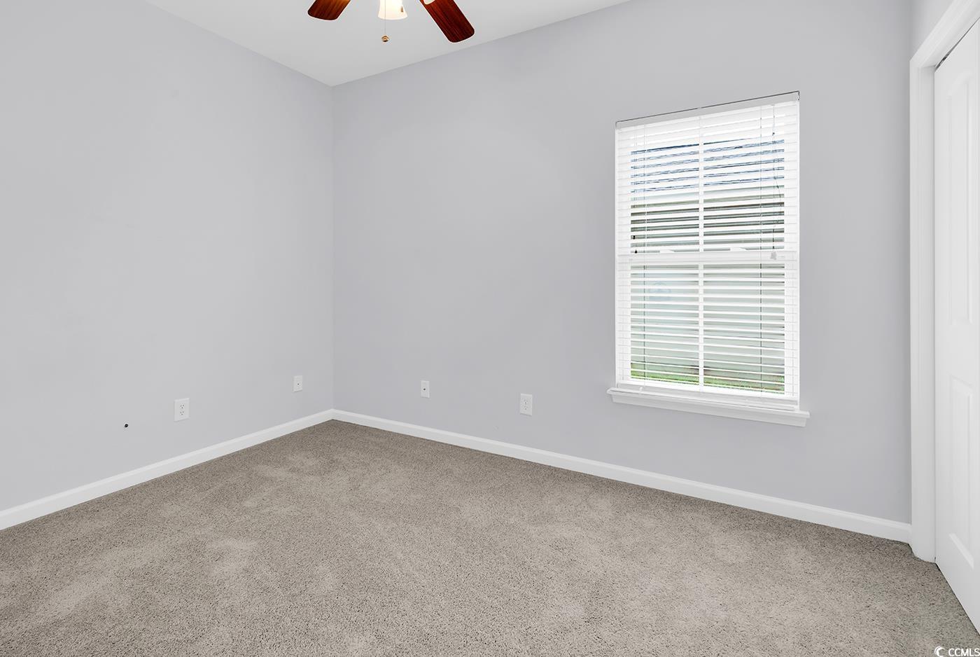 1636 Stuart Square Circle Myrtle Beach, SC 29577 - Photo 20 of 28 Carpeted spare room featuring ceiling fan and baseboards