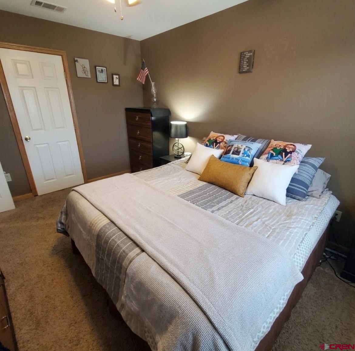 816 Main Street Manassa, CO 81141 - Photo 20 of 23 a bedroom with a bed and wooden floor