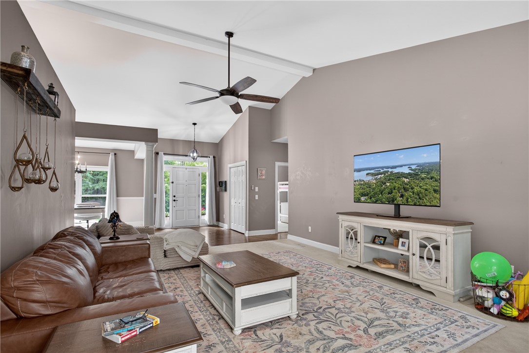 136 Loran Pointe Circle Seneca, SC 29672 - Photo 6 of 50 Step into a generous living room with soaring ceilings and rich hardwood flooring leading to an elegant entry.