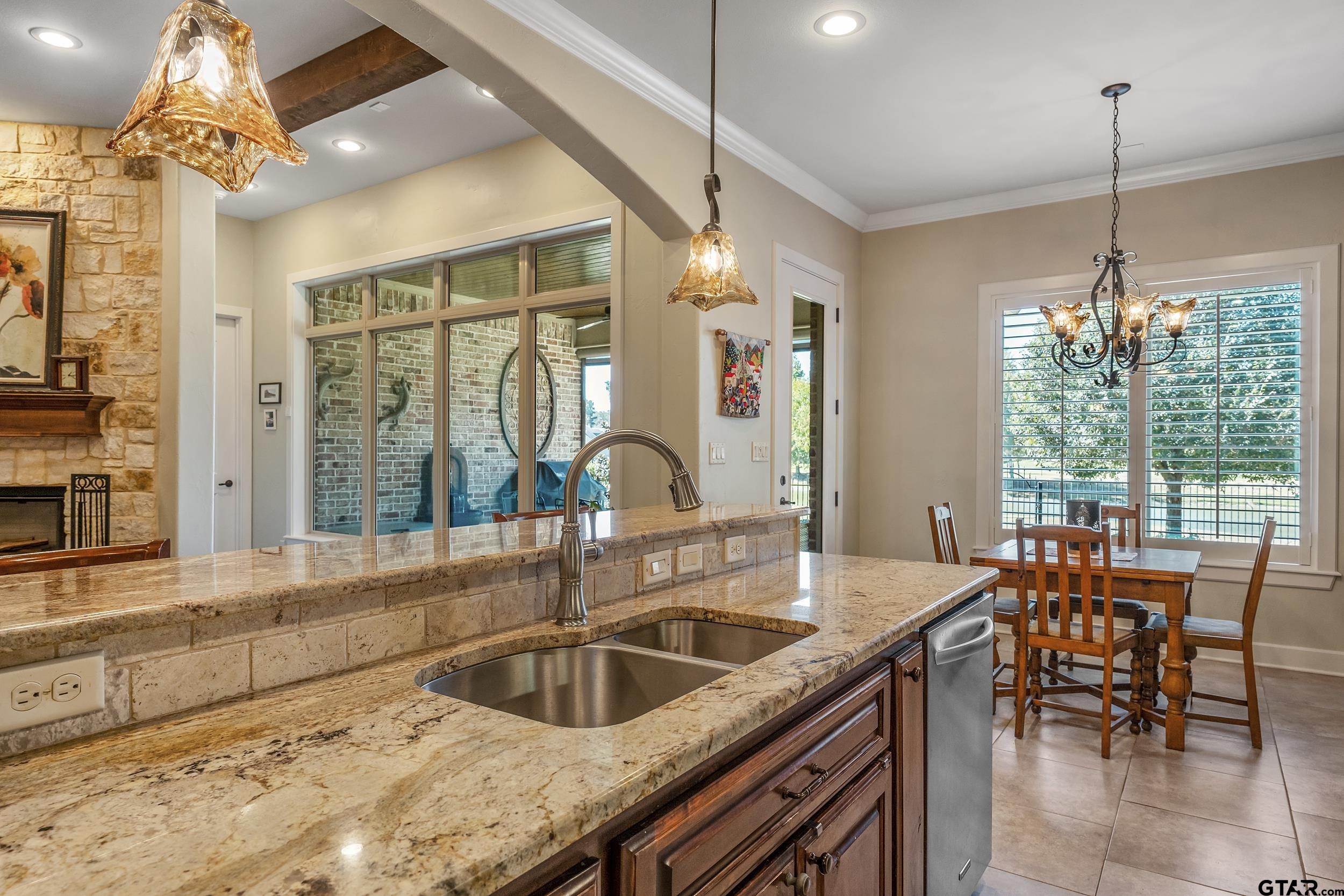 7311 Cross Road Tyler, TX 75703 - Photo 12 of 36 a kitchen with sink cabinets and outdoor view