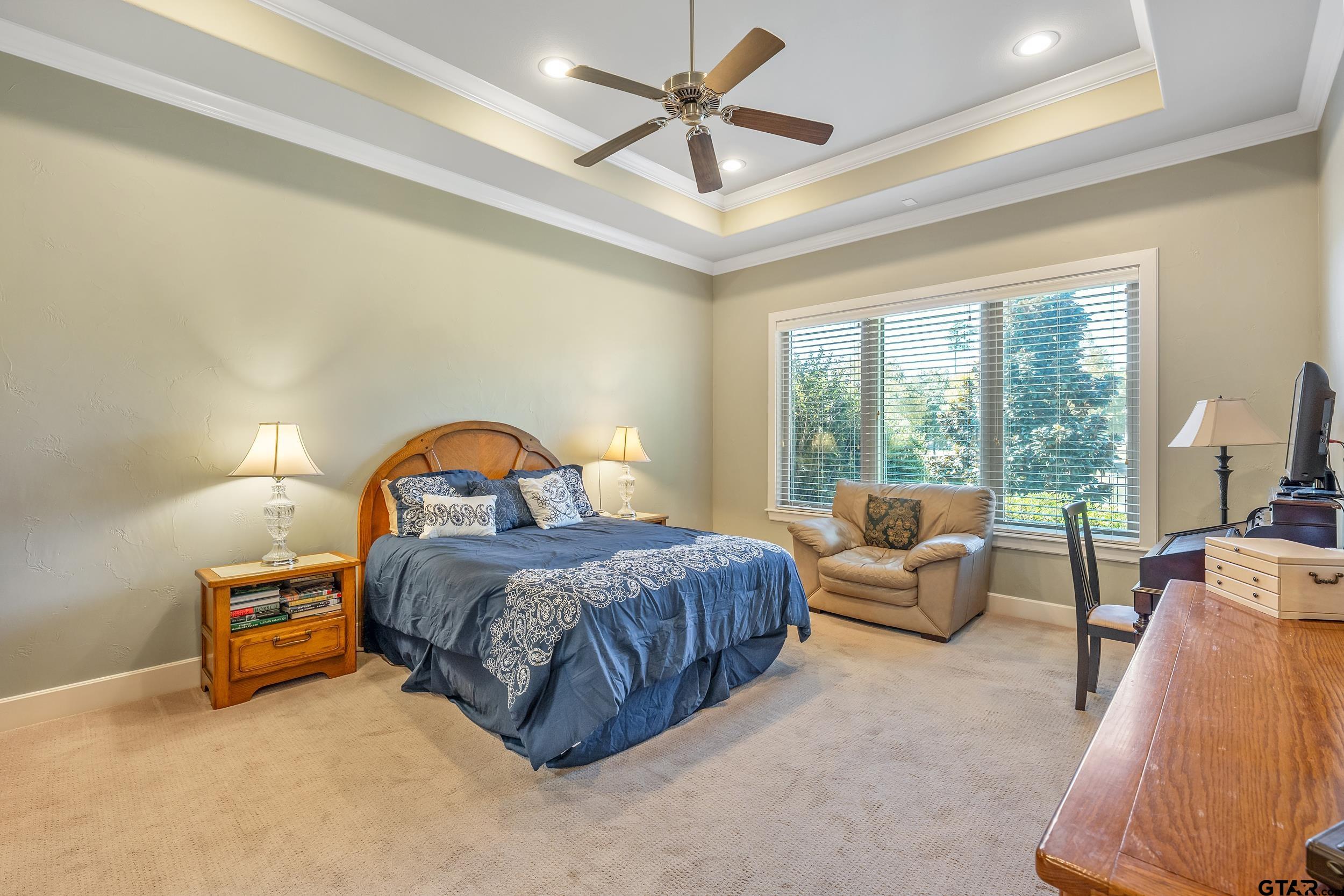 7311 Cross Road Tyler, TX 75703 - Photo 17 of 36 a bedroom with a bed couch and a large window