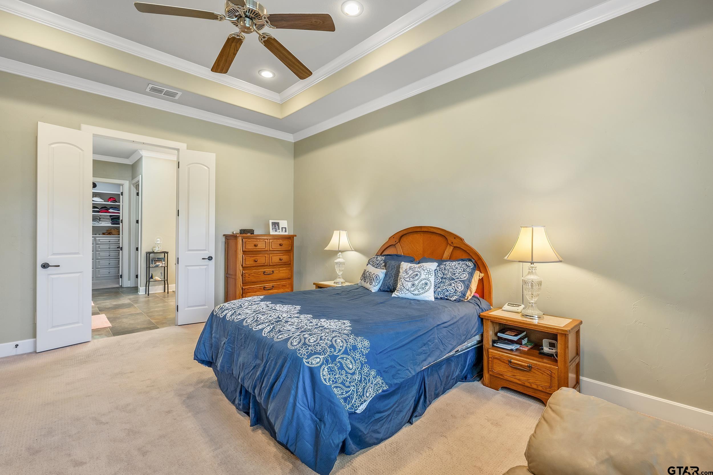 7311 Cross Road Tyler, TX 75703 - Photo 18 of 36 a bedroom with a bed and a dresser