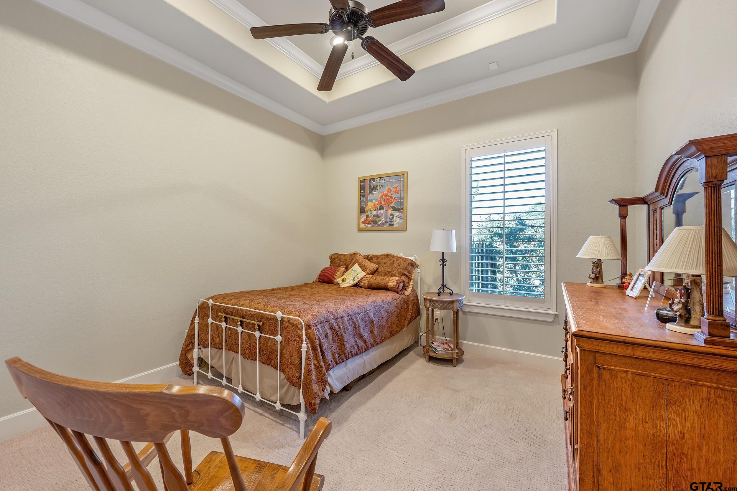 7311 Cross Road Tyler, TX 75703 - Photo 23 of 36 a bedroom with a bed window and flat screen tv