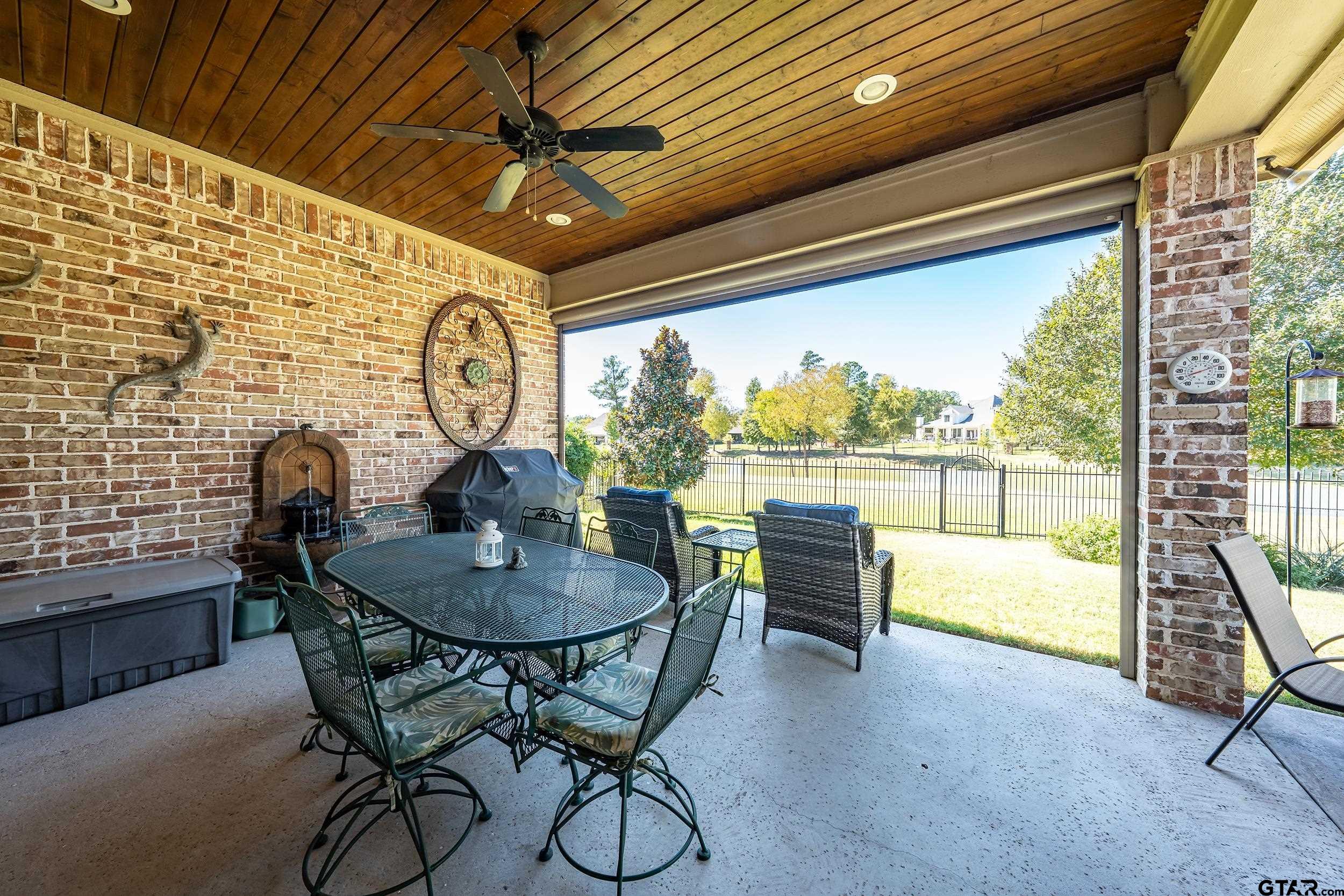 7311 Cross Road Tyler, TX 75703 - Photo 31 of 36 a dining room with furniture and a floor to ceiling window