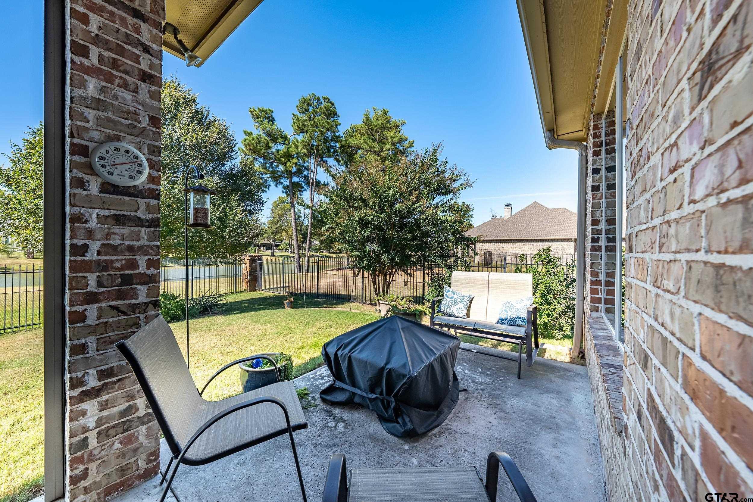 7311 Cross Road Tyler, TX 75703 - Photo 33 of 36 a view of a swimming pool with chairs in patio