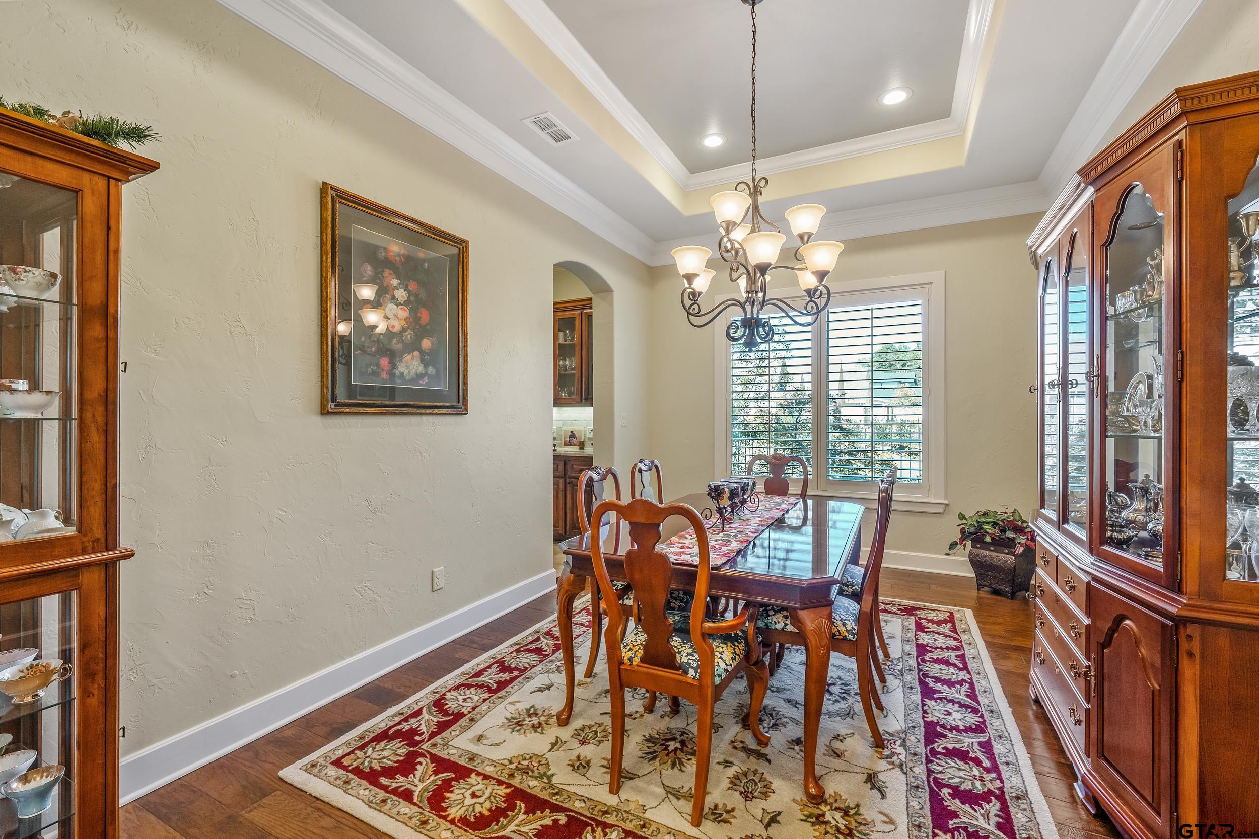 7311 Cross Road Tyler, TX 75703 - Photo 6 of 36 a view of a dining room with furniture and a chandelier
