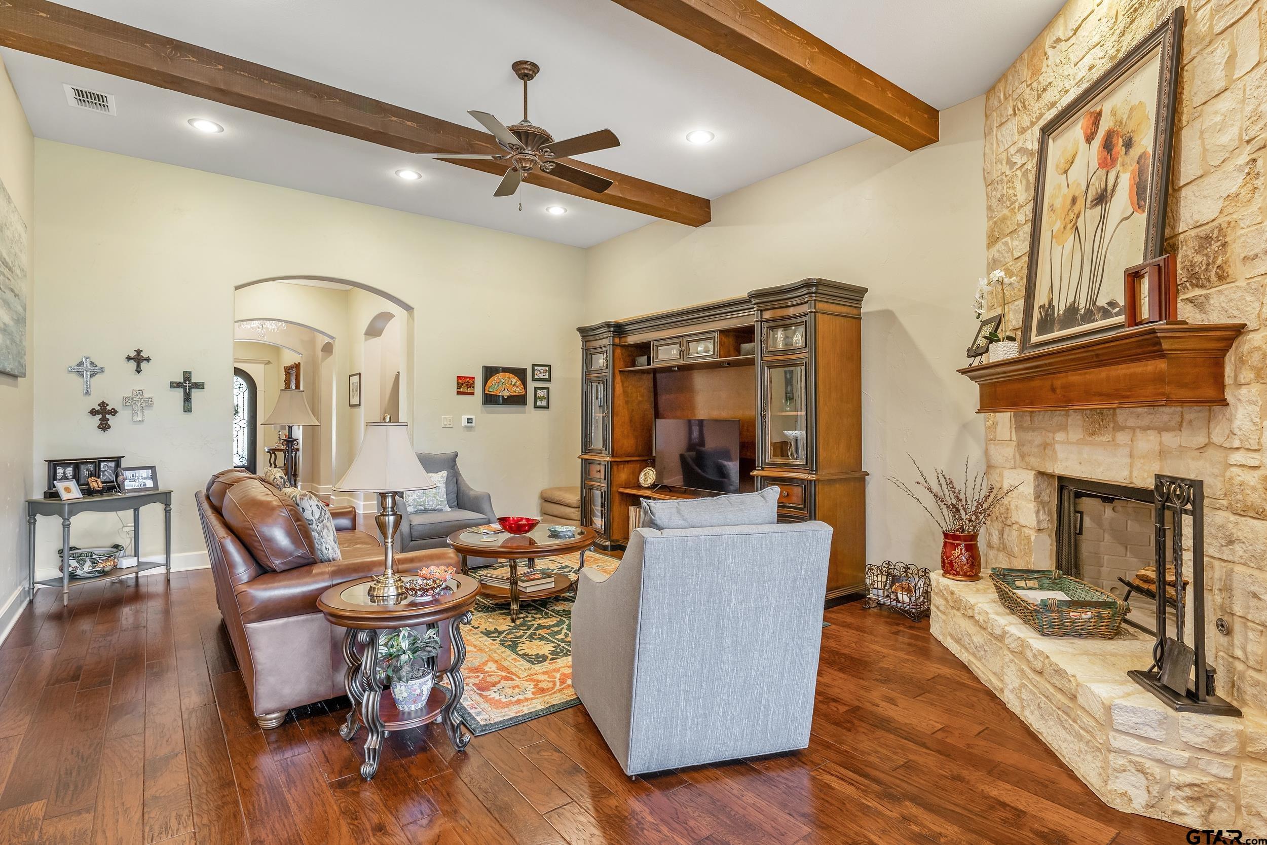 7311 Cross Road Tyler, TX 75703 - Photo 8 of 36 a living room with furniture and a fireplace