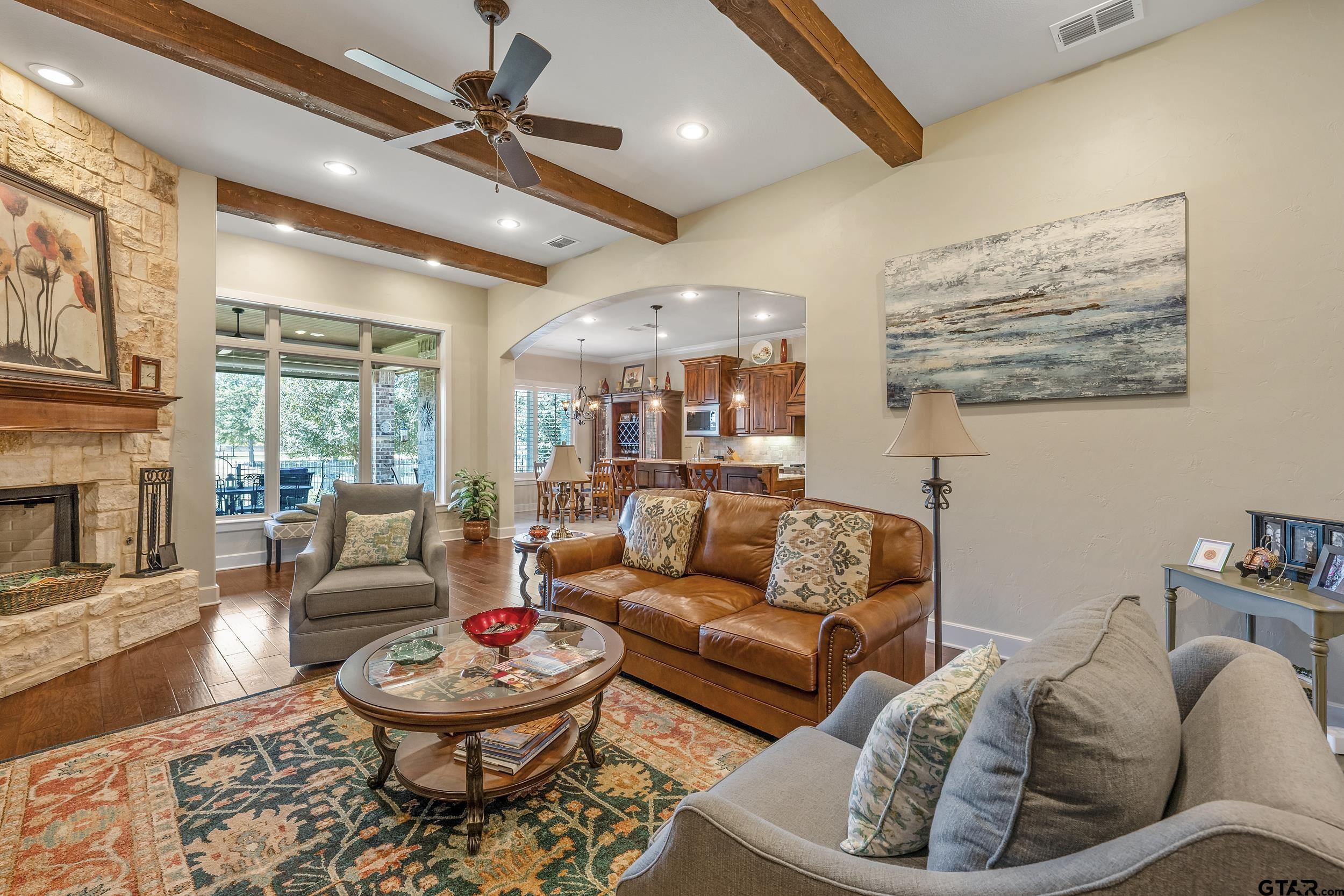 7311 Cross Road Tyler, TX 75703 - Photo 10 of 36 a living room with furniture and a fireplace