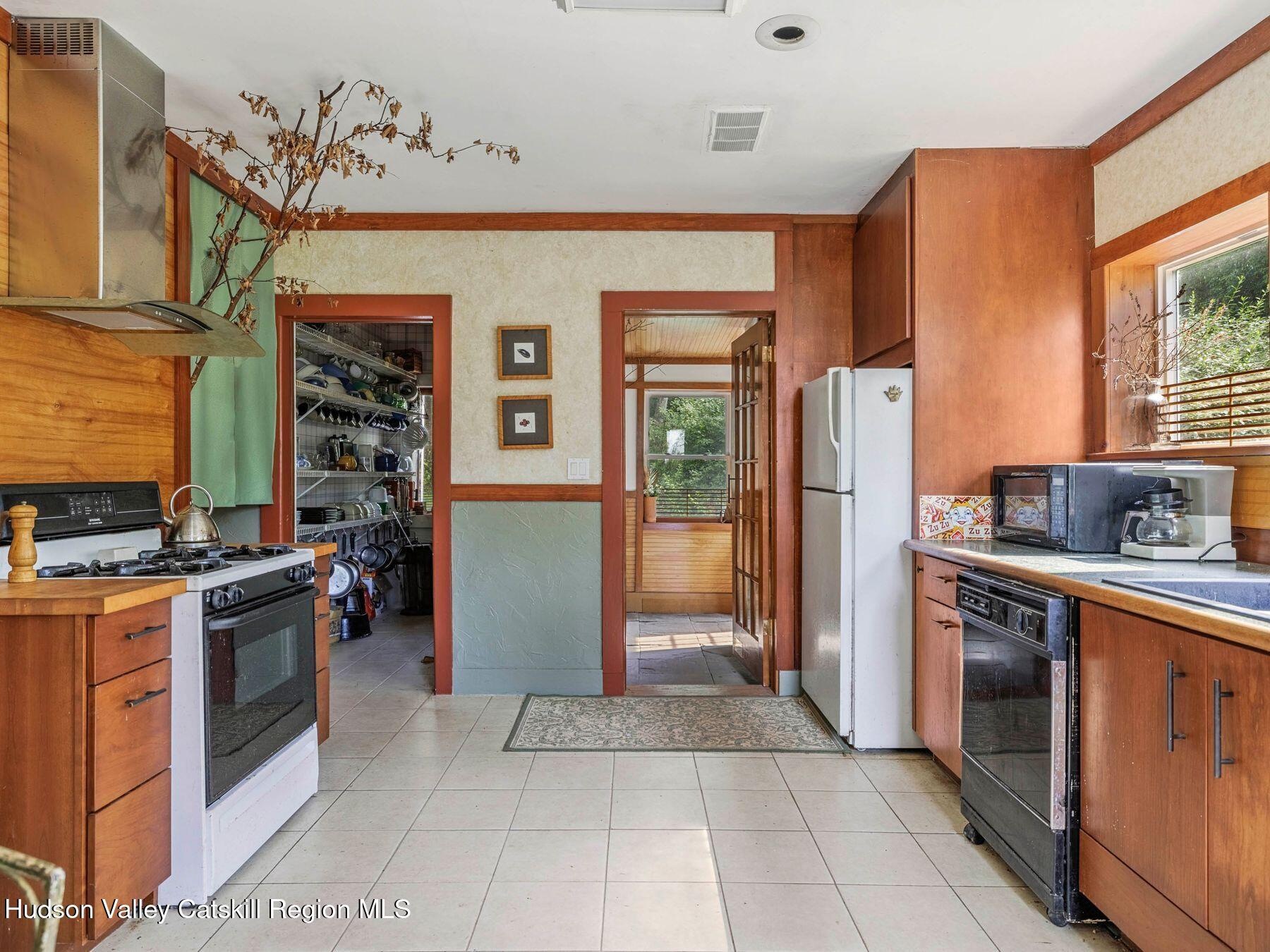 324 Schrader Road Ashland, NY 12468 - Photo 11 of 49 a kitchen with stainless steel appliances granite countertop a refrigerator and a stove top oven