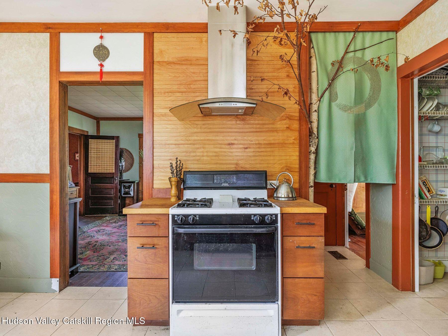 324 Schrader Road Ashland, NY 12468 - Photo 12 of 49 a kitchen with a stove and a sink
