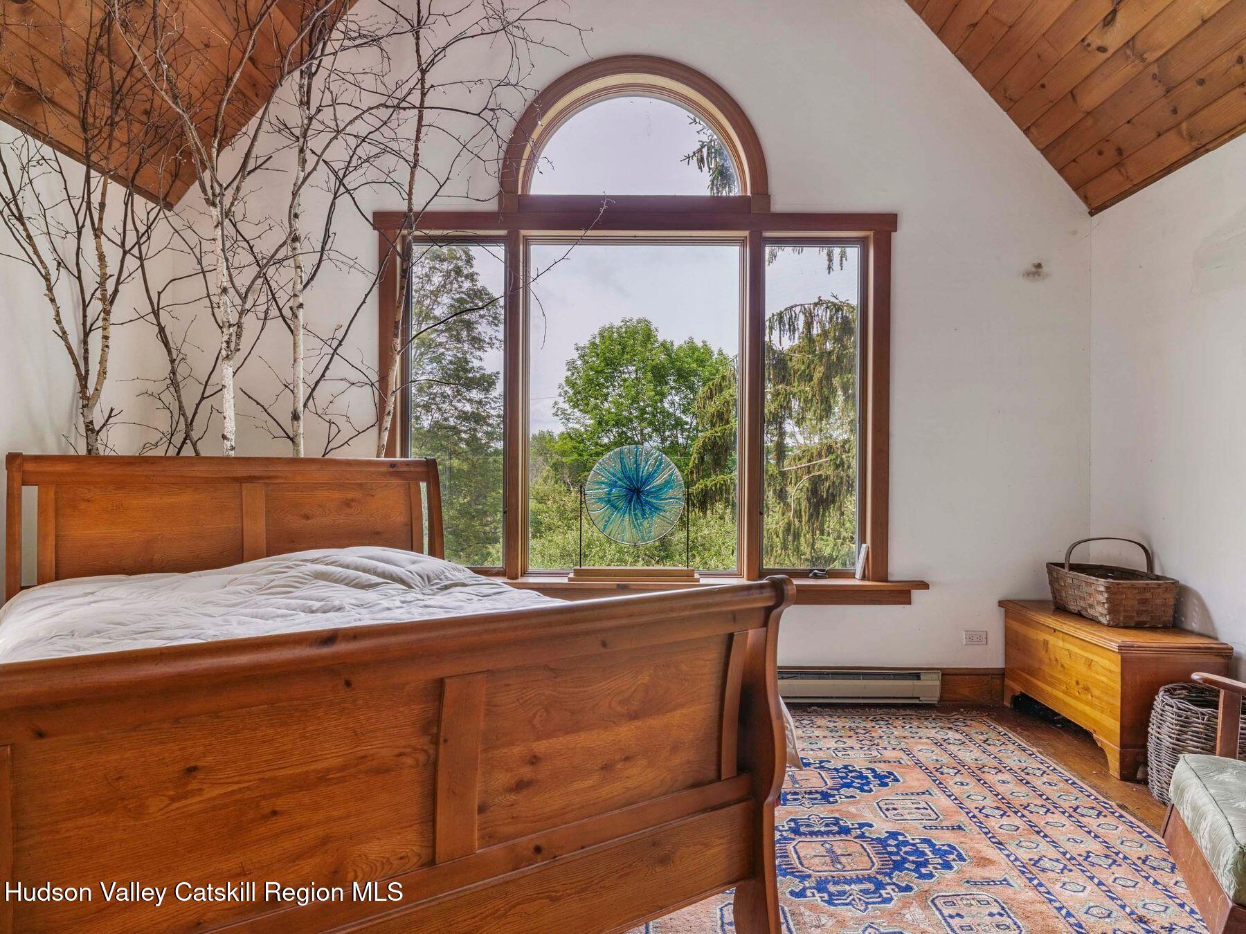 324 Schrader Road Ashland, NY 12468 - Photo 16 of 49 a bedroom with a bed and a window