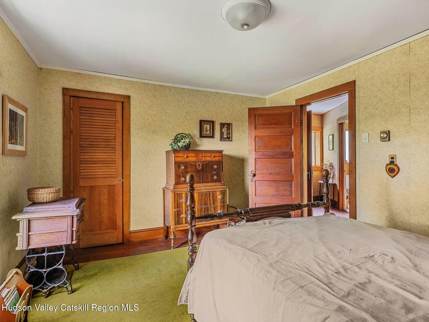 324 Schrader Road Ashland, NY 12468 - Photo 27 of 49 a bedroom with a bed and furniture