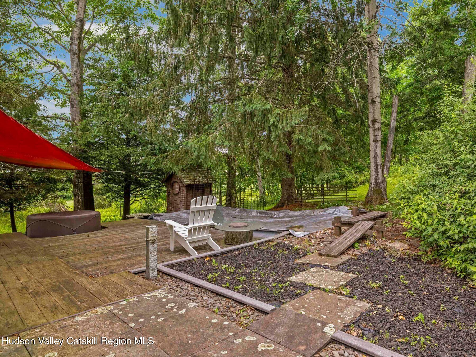 324 Schrader Road Ashland, NY 12468 - Photo 38 of 49 a patio with table and chairs and potted plants