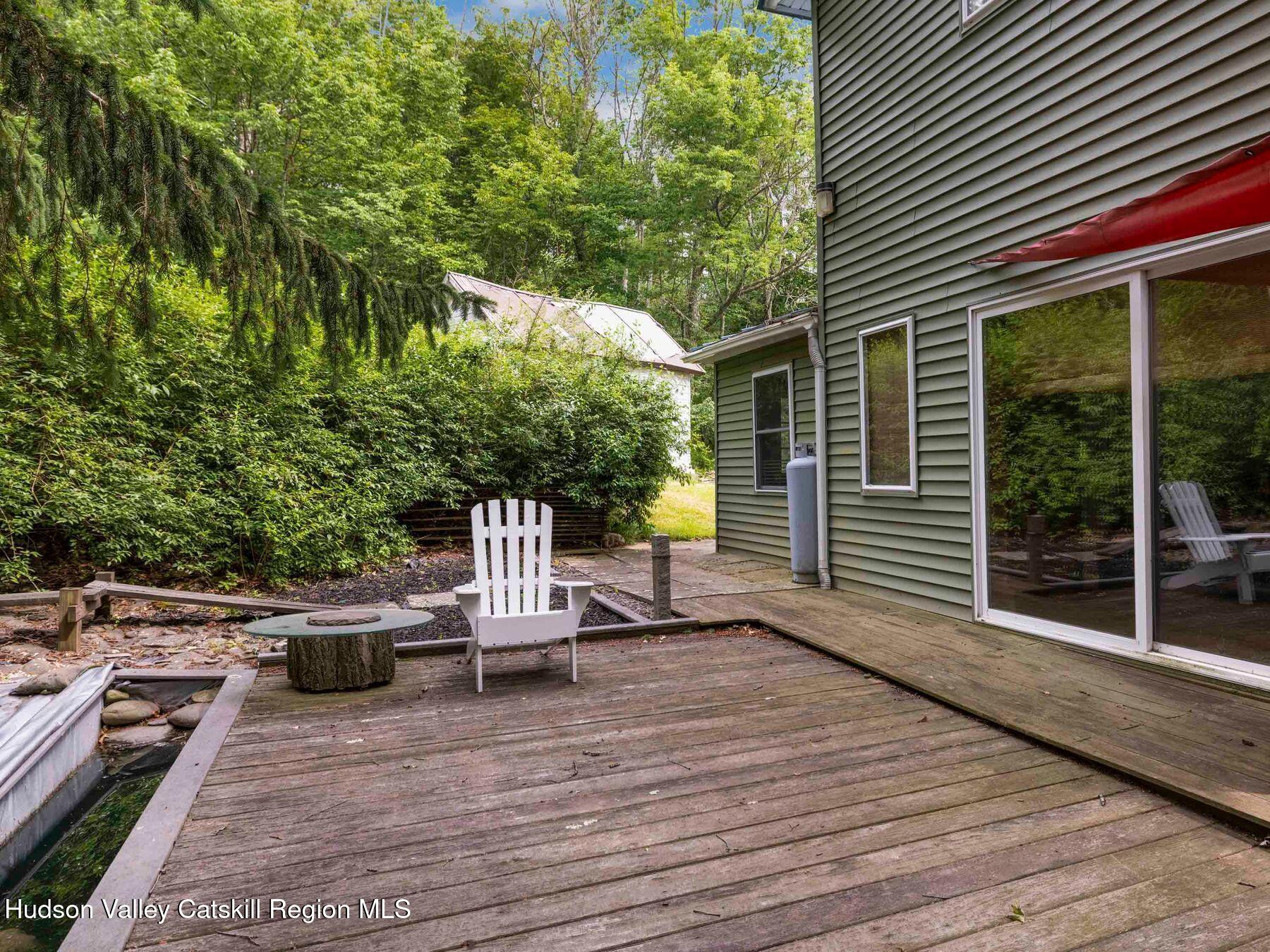 324 Schrader Road Ashland, NY 12468 - Photo 39 of 49 a view of a chair and tables in the balcony