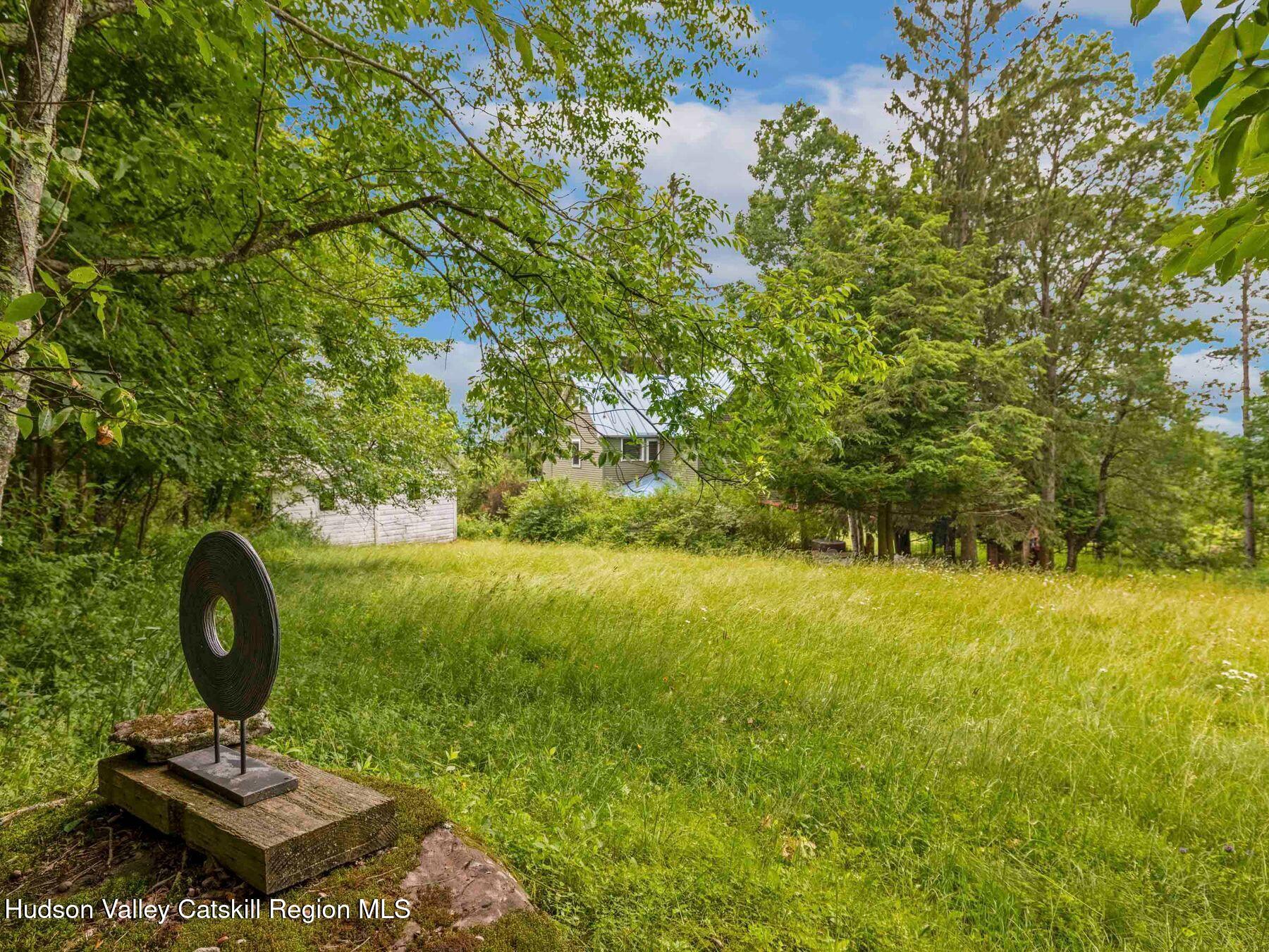 324 Schrader Road Ashland, NY 12468 - Photo 40 of 49 a view of a lake in a backyard