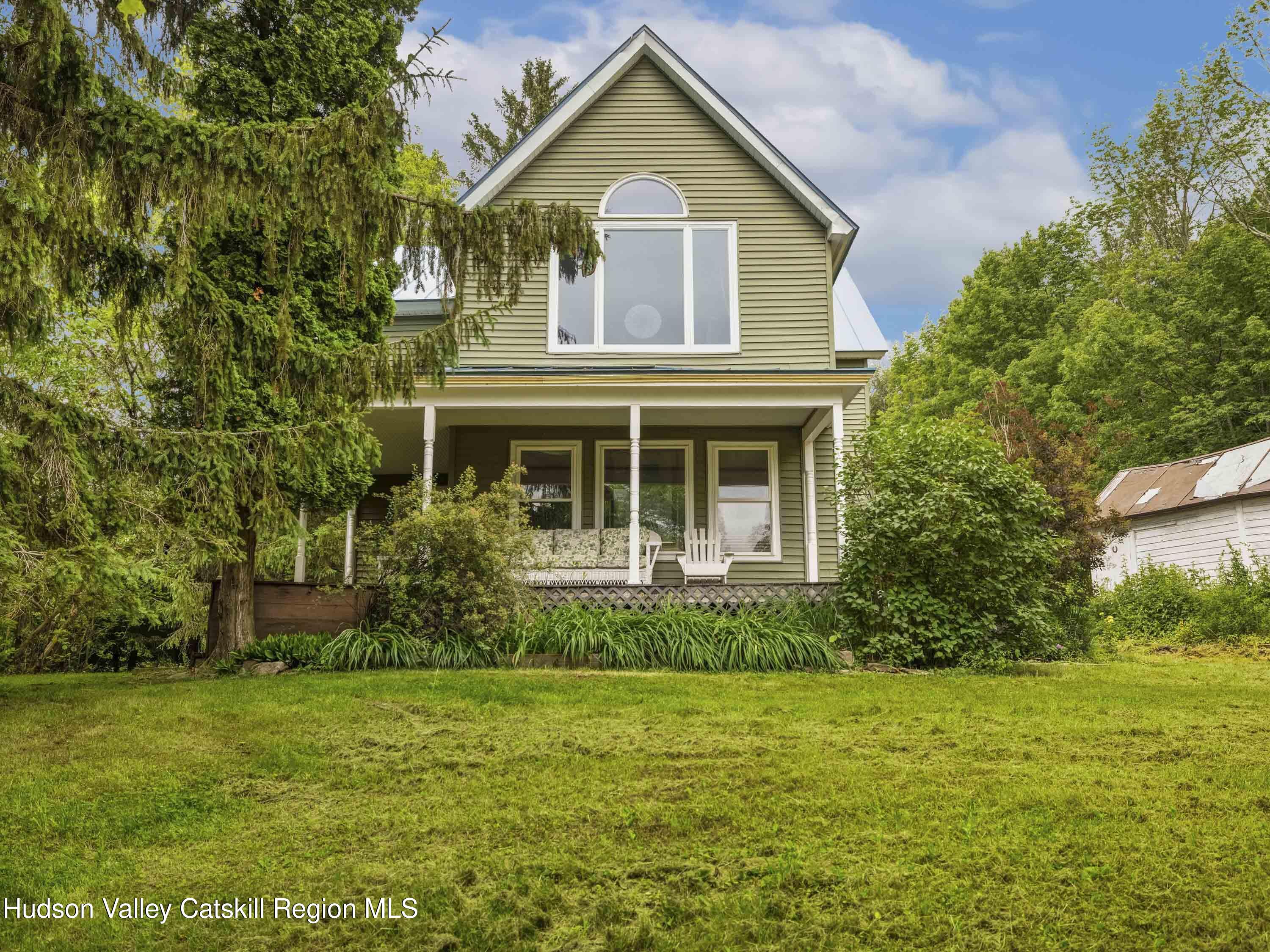 324 Schrader Road Ashland, NY 12468 - Photo 42 of 49 a front view of a house with a garden