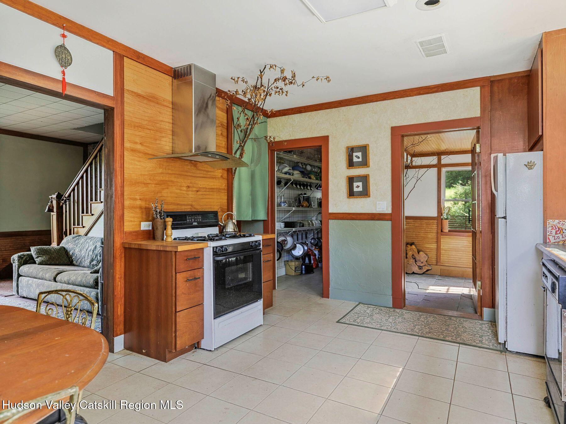 324 Schrader Road Ashland, NY 12468 - Photo 10 of 49 a view of a kitchen with an entryway and an empty room