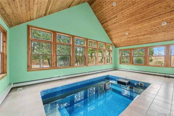a view of swimming pool with outdoor seating