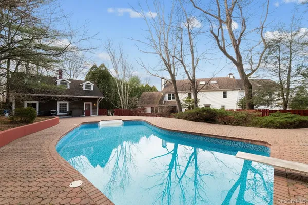 a view of a swimming pool with a patio