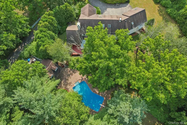 an aerial view of a house with a yard