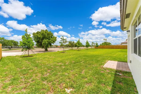 a view of a golf course with a big yard