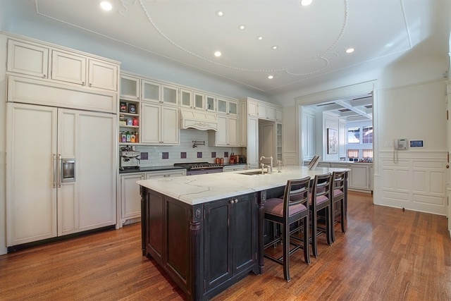 632 West Deming Place Chicago, IL 60614 - Photo 12 of 49 a kitchen with stainless steel appliances granite countertop a table chairs sink refrigerator and cabinets