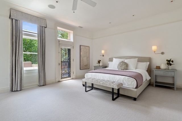 632 West Deming Place Chicago, IL 60614 - Photo 21 of 49 a spacious bedroom with a bed and a lamp