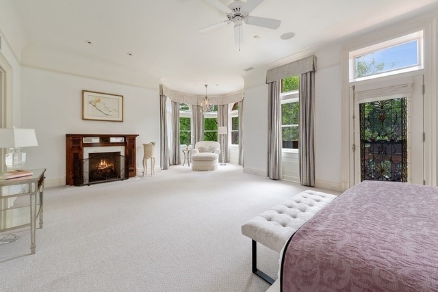 632 West Deming Place Chicago, IL 60614 - Photo 22 of 49 a bedroom with a bed and a fireplace