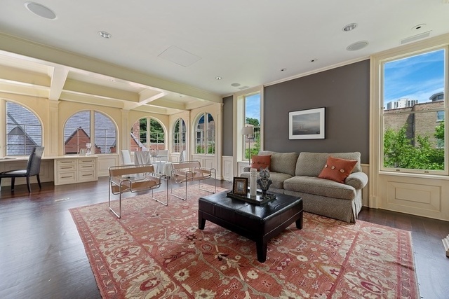 632 West Deming Place Chicago, IL 60614 - Photo 28 of 49 a living room with furniture a rug and a large window