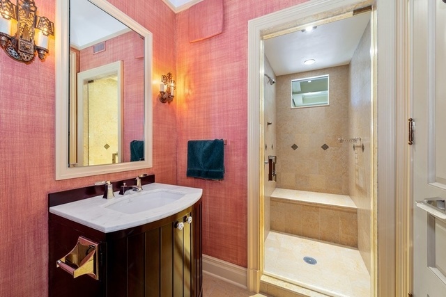 632 West Deming Place Chicago, IL 60614 - Photo 31 of 49 a bathroom with a sink and a mirror