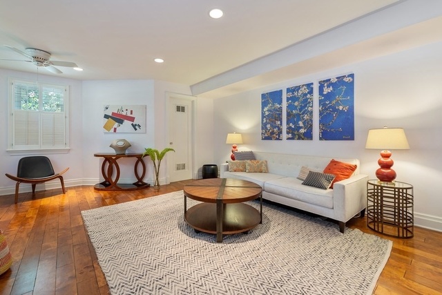 632 West Deming Place Chicago, IL 60614 - Photo 40 of 49 a living room with furniture and a flat screen tv